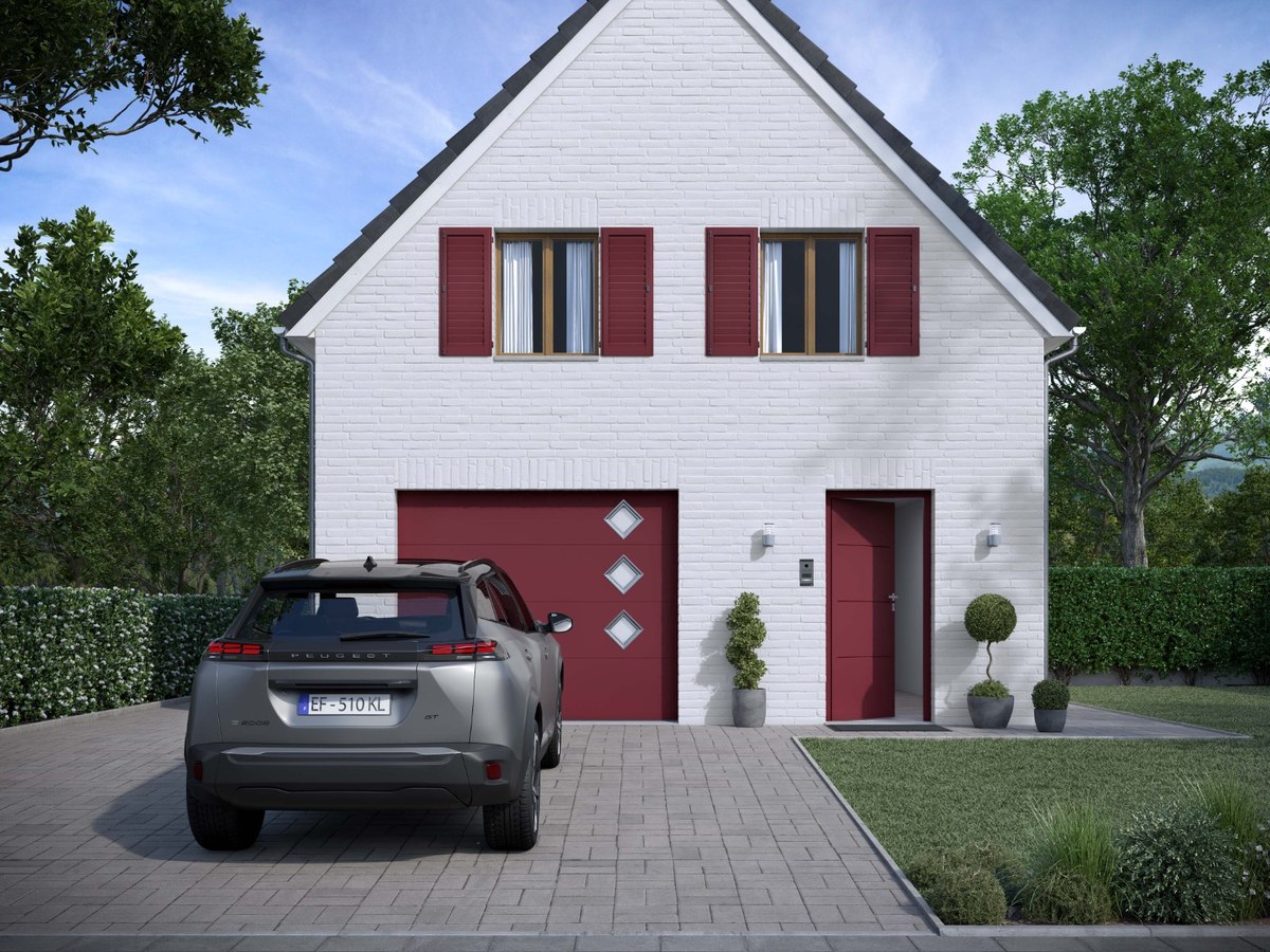 Porte de garage rouge sur une maison familiale