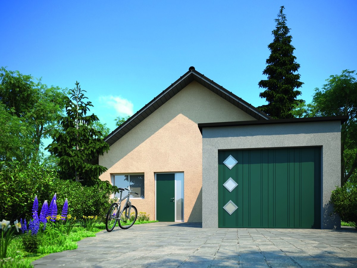 Porte de garage verte sur un garage indépendant